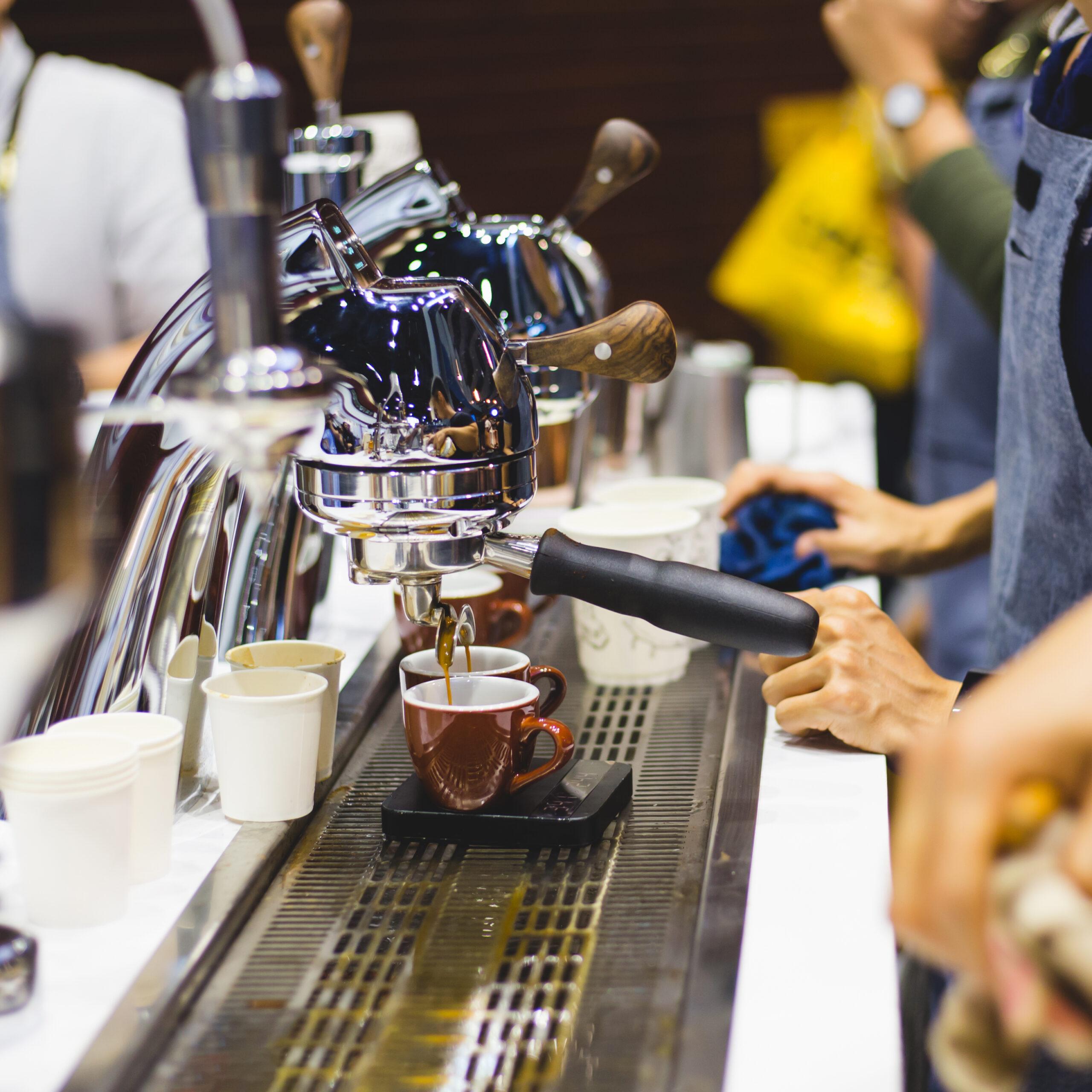 midsection man filling disposable cup with drink cafe scaled